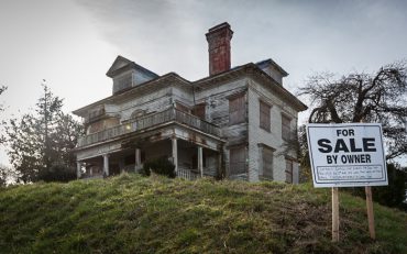 The historical George Conrad Flavel House in Astoria, Oregon, abandoned following the departure of Harry and Mary Louise Flavel.